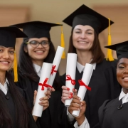 graduate-students-wearing-cap-gown-1-1-scaled